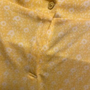 Feminine, frilly Yellow sleeveless high neck blouse